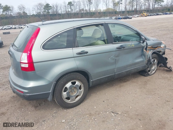 2011 Honda CR-V LX with VIN 5J6RE3H37BL008665, listed as a IAAI auction lot 42060005 with 128,447 mi miles. Bid and sale history available at carsss.com. Image 4.
