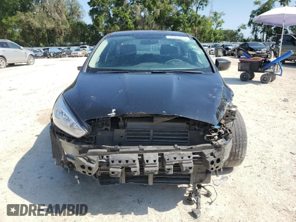 2018 Ford Focus SE z VIN 1FADP3FEXJL256542, wystawiony jako Copart lot #54583915 z przebiegiem 107 774 mil mil oraz Szkoda całkowita • Salvage title. Historia ofert i sprzedaży dostępna na DreamBid. Obrazek 5.