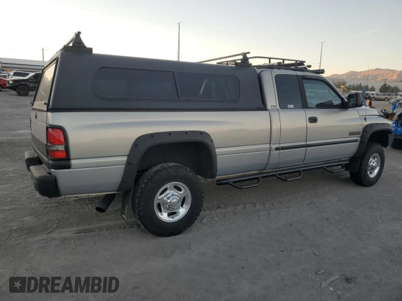 2000 Dodge 2500 z VIN 1B7KF2369YJ144753, wystawiony jako Copart lot #80801414 z przebiegiem 173 413 mil mil oraz Szkoda całkowita • Salvage title. Historia ofert i sprzedaży dostępna na DreamBid. Obrazek 3.