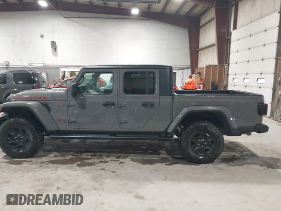 2021 Jeep Gladiator Mojave z VIN 1C6JJTEG5ML524829, wystawiony jako IAAI lot #42247982 z przebiegiem 20 158 mil mil oraz . Historia ofert i sprzedaży dostępna na DreamBid. Obrazek 14.