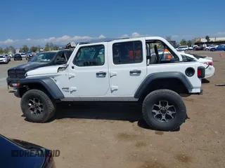 2018 Jeep Wrangler Unlimited Sport S z VIN 1C4HJXDG6JW210973, wystawiony jako IAAI lot #42154094 z przebiegiem 116 620 mil mil oraz . Historia ofert i sprzedaży dostępna na DreamBid. Obrazek 14.