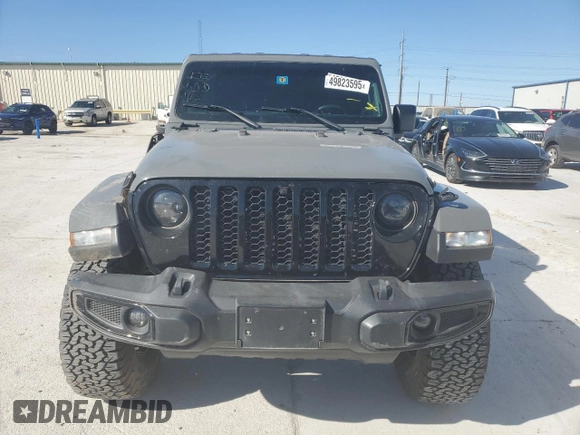 2022 Jeep Gladiator Texas Trail with VIN 1C6HJTAG8NL103449, listed as a Copart auction lot 49823595 with 60,902 mi miles and Salvage Title. Bid and sale history available at carsss.com. Image 5.