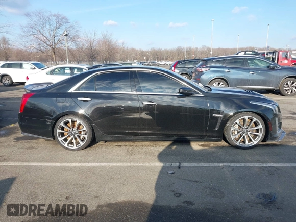 2016 Cadillac CTS-V z VIN 1G6A15S69G0148435, wystawiony jako IAAI lot #41306543 z przebiegiem 22 045 mil mil oraz . Historia ofert i sprzedaży dostępna na DreamBid. Obrazek 13.