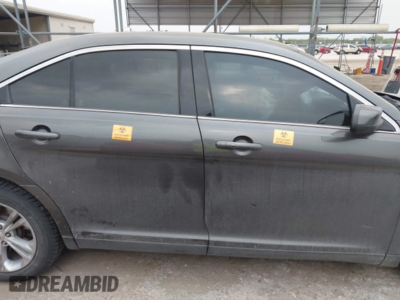 2015 Ford Taurus SEL z VIN 1FAHP2E85FG209085, wystawiony jako IAAI lot #41944532 z przebiegiem 143 850 mil mil oraz . Historia ofert i sprzedaży dostępna na DreamBid. Obrazek 13.