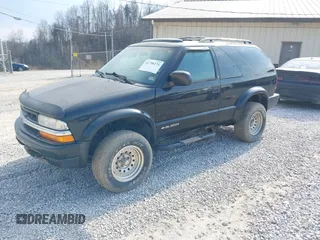 2000 Chevrolet Blazer LS z VIN 1GNCT18W1YK112722, wystawiony jako IAAI lot #41758275 z przebiegiem 157 730 mil mil oraz . Historia ofert i sprzedaży dostępna na DreamBid. Obrazek 2.