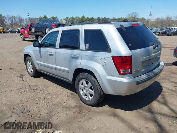 2010 Jeep Grand Cherokee Laredo with VIN 1J4PR4GKXAC141526, listed as a IAAI auction lot 41997559 with 0 mi miles. Bid and sale history available at carsss.com. Image 3.
