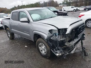 2021 Toyota Tacoma SR z VIN 3TYAX5GNXMT017989, wystawiony jako IAAI lot #41080425 z przebiegiem 76 347 mil mil oraz . Historia ofert i sprzedaży dostępna na DreamBid. Obrazek 1.