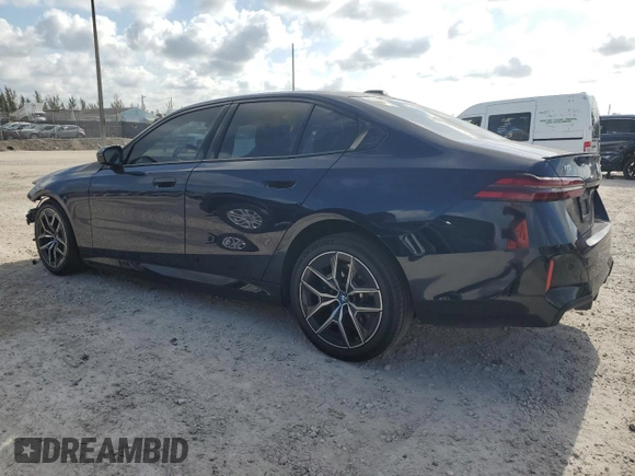 2024 BMW i5 eDrive40 with VIN WBY33FK09RCR50159, listed as a Copart auction lot 55520615 with 12,564 mi miles and Salvage title. Bid and sale history available at DreamBid. Image 2.