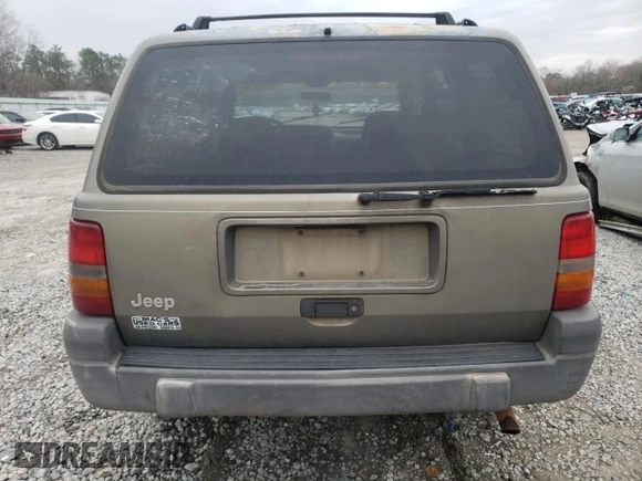 1996 Jeep Grand Cherokee Laredo with VIN 1J4FX58S5TC248122, listed as a Copart auction lot 45843935 with 295,521 mi miles and Salvage Title. Bid and sale history available at carsss.com. Image 6.