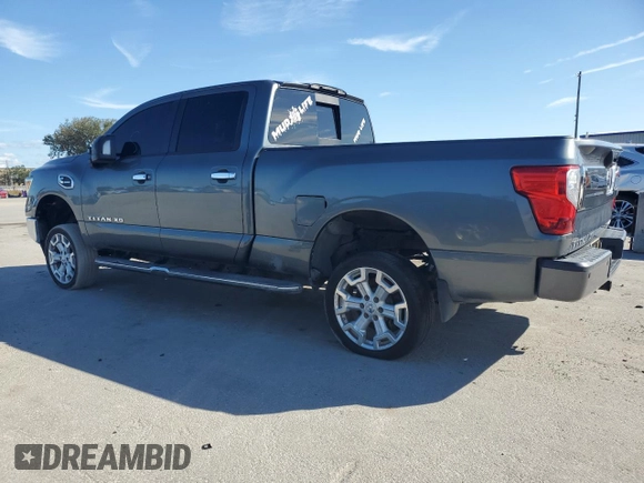 2016 Nissan Titan XD PRO-4X with VIN 1N6BA1F47GN510491, listed as a Copart auction lot 77826454 with 102,285 mi miles and Clean Title. Bid and sale history available at carsss.com. Image 2.
