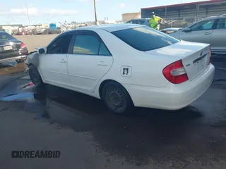 2002 Toyota Camry LE z VIN JTDBE32K120093737, wystawiony jako IAAI lot #41214245 z przebiegiem Nie podano mil oraz . Historia ofert i sprzedaży dostępna na DreamBid. Obrazek 3.