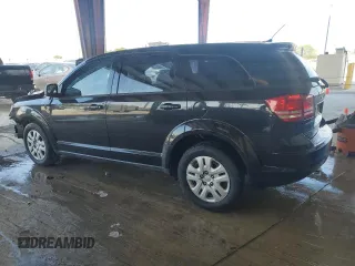 2013 Dodge Journey American Value with VIN 3C4PDCAB2DT684871, listed as a Copart auction lot 52288915 with 119,569 mi miles and Salvage title. Bid and sale history available at DreamBid. Image 2.