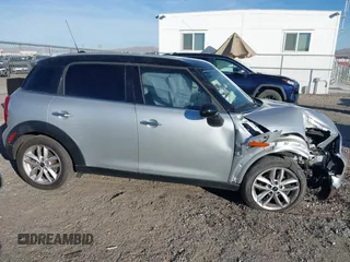 2012 MINI Countryman with VIN WMWZB3C59CWM05749, listed as a IAAI auction lot 38329304 with 64,590 mi miles and . Bid and sale history available at DreamBid. Image 13.