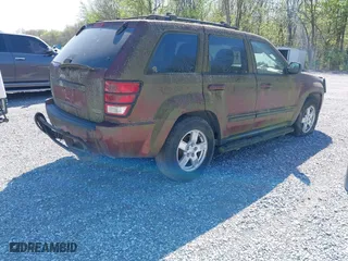 2007 Jeep Grand Cherokee Laredo with VIN 1J8HR48P07C694448, listed as a IAAI auction lot 41956077 with 232,366 mi miles. Bid and sale history available at carsss.com. Image 4.