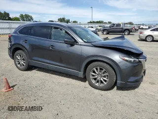 2019 Mazda CX-9 Touring with VIN JM3TCBCY0K0309947, listed as a Copart auction lot 56897815 with 87,517 mi miles and Salvage title. Bid and sale history available at DreamBid. Image 4.