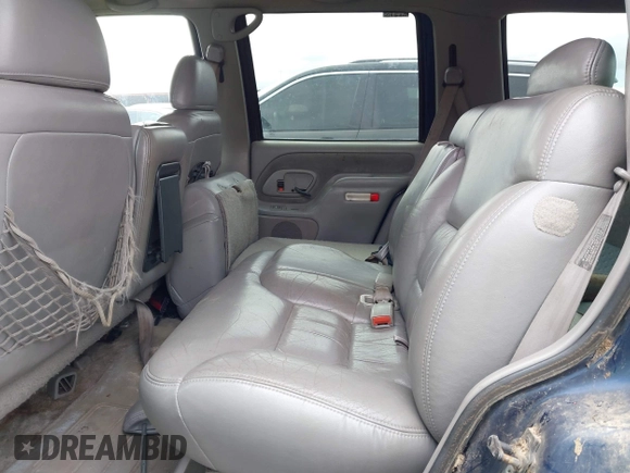 1997 GMC Yukon with VIN 1GKEK13R6VJ715421, listed as a IAAI auction lot 41811398 with 214,735 mi miles. Bid and sale history available at carsss.com. Image 8.
