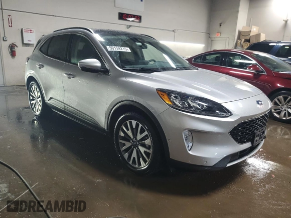 2020 Ford Escape Titanium Hybrid z VIN 1FMCU9DZ6LUB39475, wystawiony jako Copart lot #50159215 z przebiegiem 76 496 mil mil oraz Szkoda całkowita • Salvage title. Historia ofert i sprzedaży dostępna na DreamBid. Obrazek 4.