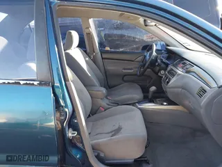 2005 Mitsubishi Lancer ES with VIN JA3AJ26E65U014838, listed as a IAAI auction lot 41310586 with 127,487 mi miles. Bid and sale history available at carsss.com. Image 5.