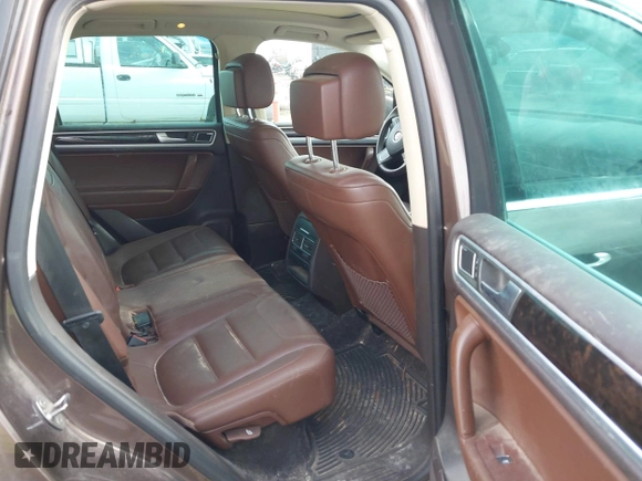 2013 Volkswagen Touareg Lux with VIN WVGEF9BP1DD012851, listed as a IAAI auction lot 41732391 with 123,283 mi miles and . Bid and sale history available at DreamBid. Image 8.