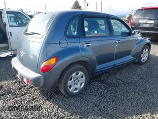 2003 Chrysler PT Cruiser with VIN 3C4FY48B13T570032, listed as a IAAI auction lot 41603951 with 97,590 mi miles. Bid and sale history available at carsss.com. Image 4.