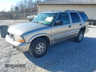 2001 GMC Jimmy SLE z VIN 1GKDT13W812117348, wystawiony jako IAAI lot #41846712 z przebiegiem 180 977 mil mil oraz . Historia ofert i sprzedaży dostępna na DreamBid. Obrazek 2.