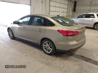 2016 Ford Focus SE z VIN 1FADP3F23GL277537, wystawiony jako IAAI lot #41603658 z przebiegiem 107 115 mil mil oraz . Historia ofert i sprzedaży dostępna na DreamBid. Obrazek 3.