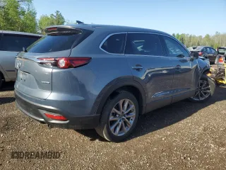 2023 Mazda CX-9 Touring z VIN JM3TCBCYXP0650893, wystawiony jako Copart lot #56875635 z przebiegiem 30 055 mil mil oraz Czysty tytuł • Clean title. Historia ofert i sprzedaży dostępna na DreamBid. Obrazek 3.