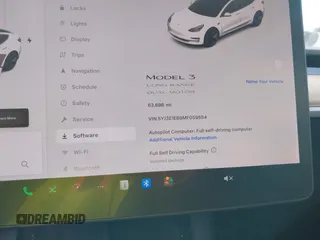 2021 Tesla Model 3 Long Range with VIN 5YJ3E1EB9MF059554, listed as a IAAI auction lot 41231520 with 63,696 mi miles and . Bid and sale history available at DreamBid. Image 7.