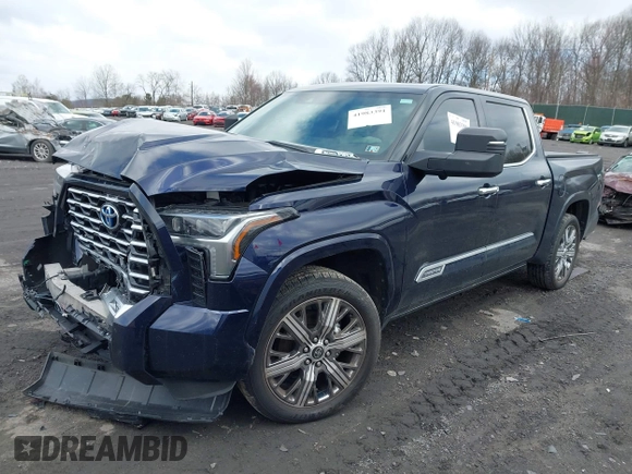 2022 Toyota Tundra Capstone Hybrid with VIN 5TFVC5DB5NX009829, listed as a IAAI auction lot 41983391 with 70,015 mi miles and . Bid and sale history available at DreamBid. Image 2.