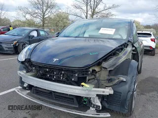 2022 Tesla Model Y Long Range with VIN 7SAYGAEE4NF522330, listed as a IAAI auction lot 42046691 with 59,980 mi miles and . Bid and sale history available at carsss.com. Image 6.
