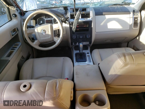2009 Mercury Mariner Premier z VIN 4M2CU87789KJ23933, wystawiony jako Copart lot #45120455 z przebiegiem 104 465 mil mil oraz Szkody całkowita. Historia ofert i sprzedaży dostępna na DreamBid. Obrazek 8.