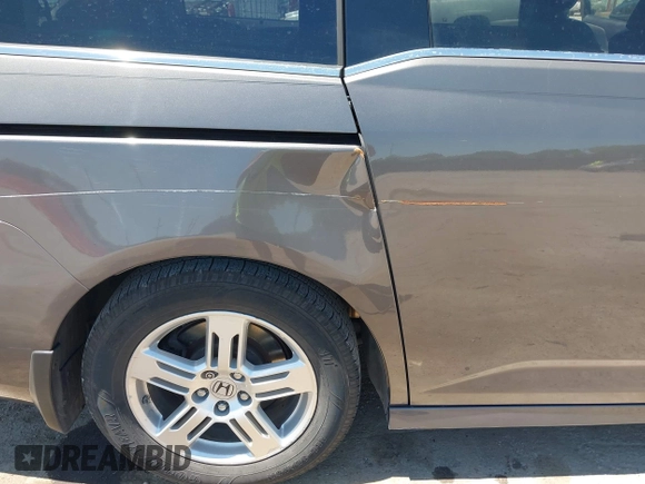 2012 Honda Odyssey Touring with VIN 5FNRL5H93CB109394, listed as a IAAI auction lot 42280018 with 190,412 mi miles and . Bid and sale history available at DreamBid. Image 6.