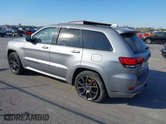 2020 Jeep Grand Cherokee Overland with VIN 1C4RJFCG8LC158475, listed as a IAAI auction lot 40665109 with 77,233 mi miles. Bid and sale history available at carsss.com. Image 3.