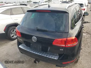 2012 Volkswagen Touareg Exec with VIN WVGEF9BP1CD011407, listed as a Copart auction lot 79199754 with 57,376 mi miles and Salvage Title. Bid and sale history available at DreamBid. Image 6.
