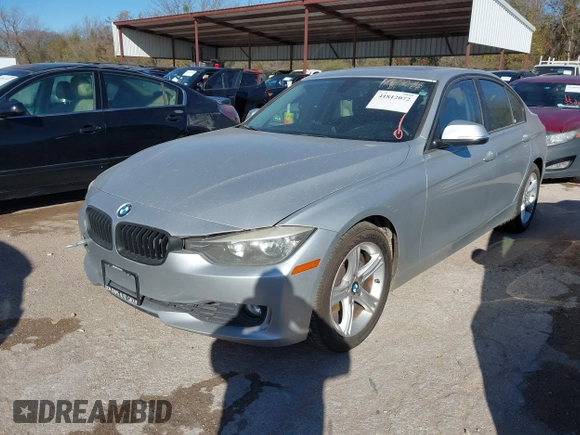 2012 BMW 3 Series 328i with VIN WBA3A5C5XCF345274, listed as a IAAI auction lot 41812072 with 142,024 mi miles. Bid and sale history available at carsss.com. Image 2.