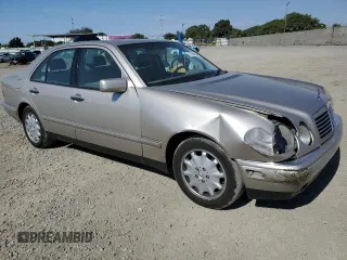 1999 Mercedes-Benz E-Class with VIN WDBJF65H5XA804902, listed as a Copart auction lot 73704634 with 92,411 mi miles and Salvage Title. Bid and sale history available at carsss.com. Image 4.