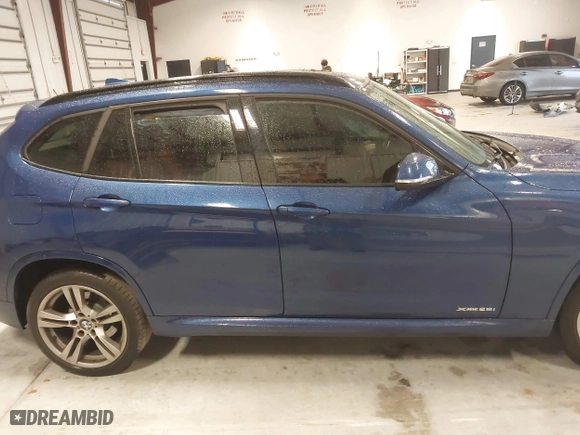 2015 BMW X1 xDrive28i with VIN WBAVL1C57FVY35998, listed as a IAAI auction lot 41740072 with 84,233 mi miles. Bid and sale history available at carsss.com. Image 12.