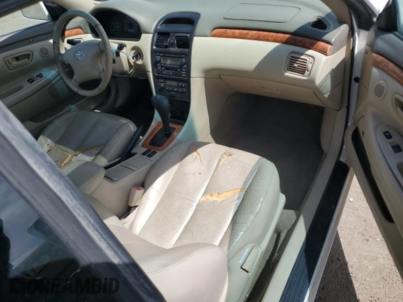 2002 Toyota Solara SE with VIN 2T1CF28P82C601593, listed as a Copart auction lot 60487005 with 137,624 mi miles and Salvage title. Bid and sale history available at DreamBid. Image 8.