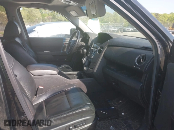 2012 Honda Pilot Touring with VIN 5FNYF4H95CB026191, listed as a IAAI auction lot 42021987 with 229,273 mi miles and . Bid and sale history available at DreamBid. Image 5.