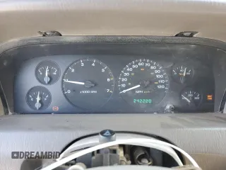 1999 Jeep Grand Cherokee Limited with VIN 1J4GW68S2XC677334, listed as a Copart auction lot 74152054 with 242,220 mi miles and Salvage Title. Bid and sale history available at carsss.com. Image 9.