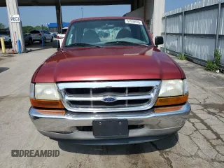 1999 Ford Ranger XL with VIN 1FTYR14V2XPB56627, listed as a Copart auction lot 57036435 with 215,050 mi miles and Salvage title. Bid and sale history available at DreamBid. Image 5.
