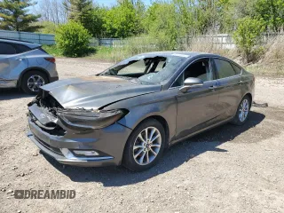 2017 Ford Fusion SE z VIN 3FA6P0HD9HR144774, wystawiony jako Copart lot #55999475 z przebiegiem Nie podano mil oraz Czysty tytuł • Clean title. Historia ofert i sprzedaży dostępna na DreamBid. Obrazek 1.