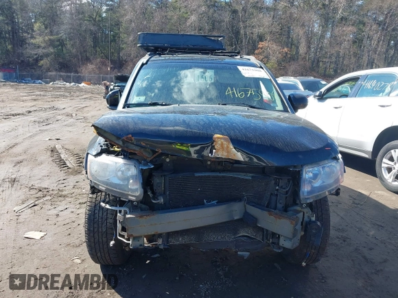 2014 Jeep Compass Latitude with VIN 1C4NJDEB2ED626380, listed as a IAAI auction lot 41675908 with 90,153 mi miles. Bid and sale history available at carsss.com. Image 13.