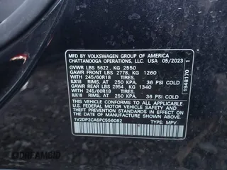 2023 Volkswagen Atlas SE z VIN 1V2DP2CA5PC556082, wystawiony jako IAAI lot #41072963 z przebiegiem 31 670 mil mil oraz . Historia ofert i sprzedaży dostępna na DreamBid. Obrazek 9.