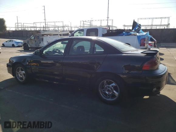 2002 Pontiac Grand Am GT with VIN 1G2NW52E12M704539, listed as a Copart auction lot 73755214 with 100,904 mi miles and Clean Title. Bid and sale history available at carsss.com. Image 2.