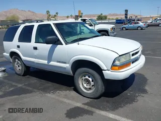 2004 Chevrolet Blazer LS z VIN 1GNDT13XX4K139559, wystawiony jako IAAI lot #42126705 z przebiegiem 197 460 mil mil oraz . Historia ofert i sprzedaży dostępna na DreamBid. Obrazek 1.