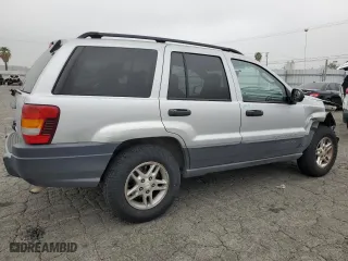 2004 Jeep Grand Cherokee Laredo with VIN 1J4GX48S64C151124, listed as a Copart auction lot 52669445 with 152,970 mi miles and Salvage Title. Bid and sale history available at carsss.com. Image 3.