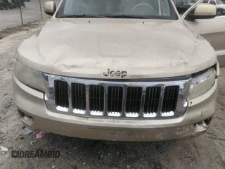 2012 Jeep Grand Cherokee Laredo with VIN 1C4RJEAGXCC157616, listed as a IAAI auction lot 42156539 with 301,661 mi miles. Bid and sale history available at carsss.com. Image 6.