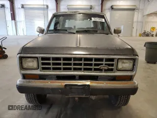 1988 Ford Bronco z VIN 1FMCU14T4JUA54161, wystawiony jako Copart lot #76312054 z przebiegiem 34 932 mil mil oraz Szkoda całkowita • Salvage title. Historia ofert i sprzedaży dostępna na DreamBid. Obrazek 5.