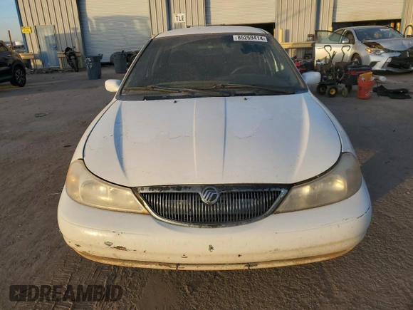1999 Mercury Mystique GS z VIN 1MEFM6532XK638087, wystawiony jako Copart lot #85269414 z przebiegiem 192 506 mil mil oraz Szkody całkowita. Historia ofert i sprzedaży dostępna na DreamBid. Obrazek 5.